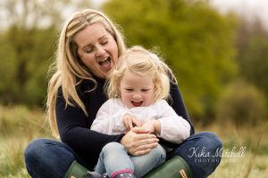 laughing family in outdoor shoot Chelmsford with Kika Mitchell photography