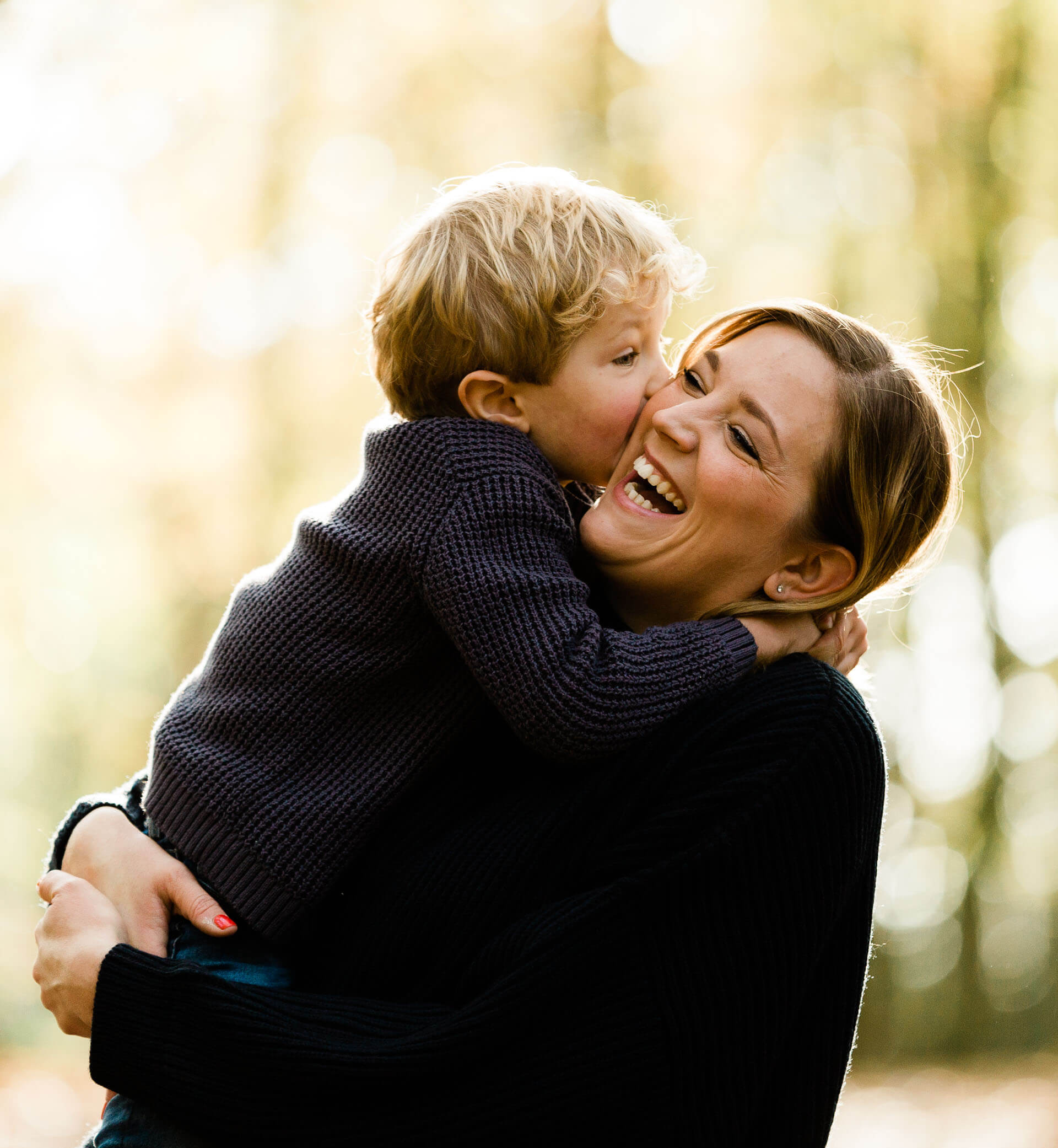 Mother and son laugh and cuddle at Danbury country park photographed by Kika Mitchell Photography Chelmsford photographer