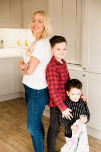 Emily Norris and sons compare height back to back on latest family shoot in Brentwood home by Chelmsford photographer Kika Mitchell Photographer