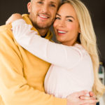 Emily Norris and husband cuddle in portrait image by Chelmsford photographer Kika Mitchell Photographer