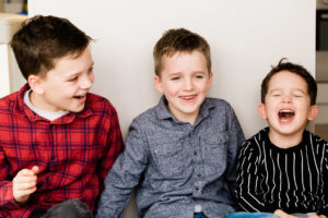 3 happy young boys taken on family photoshoot with Emily Norris by Kika Mitchell Chelmsford photographer