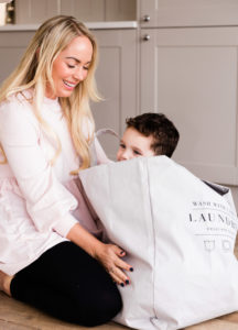 Emily Norris and youngest son in laundry bag taken on latest family shoot by Chelmsford photographer Kika Mitchell Photography
