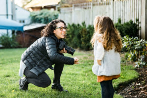 behind the scenes with Chelmsford photographer Kika Mitchell Photography on her personal branding shoot with child in garden