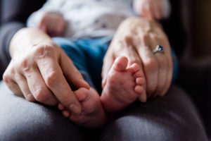 lockdown baby feet and mothers hands by Chelmsford photographer Kika Mitchell Photography