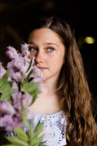 girl in blue dress with purple flowers captured by Chelmsford photographer Kika Mitchell Photography