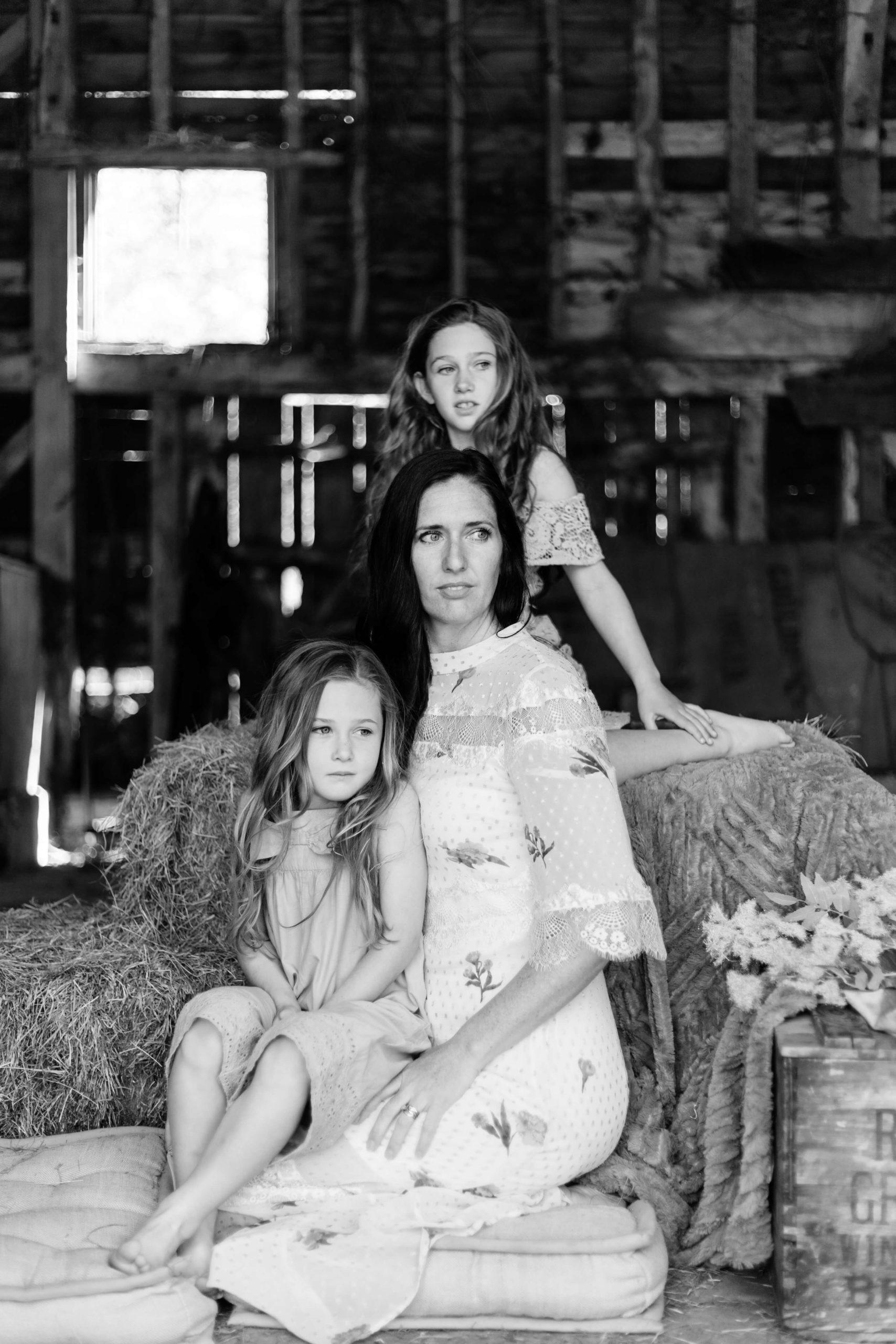 monochrome portrait of motherhood as 3 females look to left by Chelmsford photographer Kika MItchell