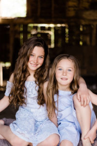 sisters in blue captured on portraits of motherhood shoot by chelmsford photographer Kika Mitchell Photography