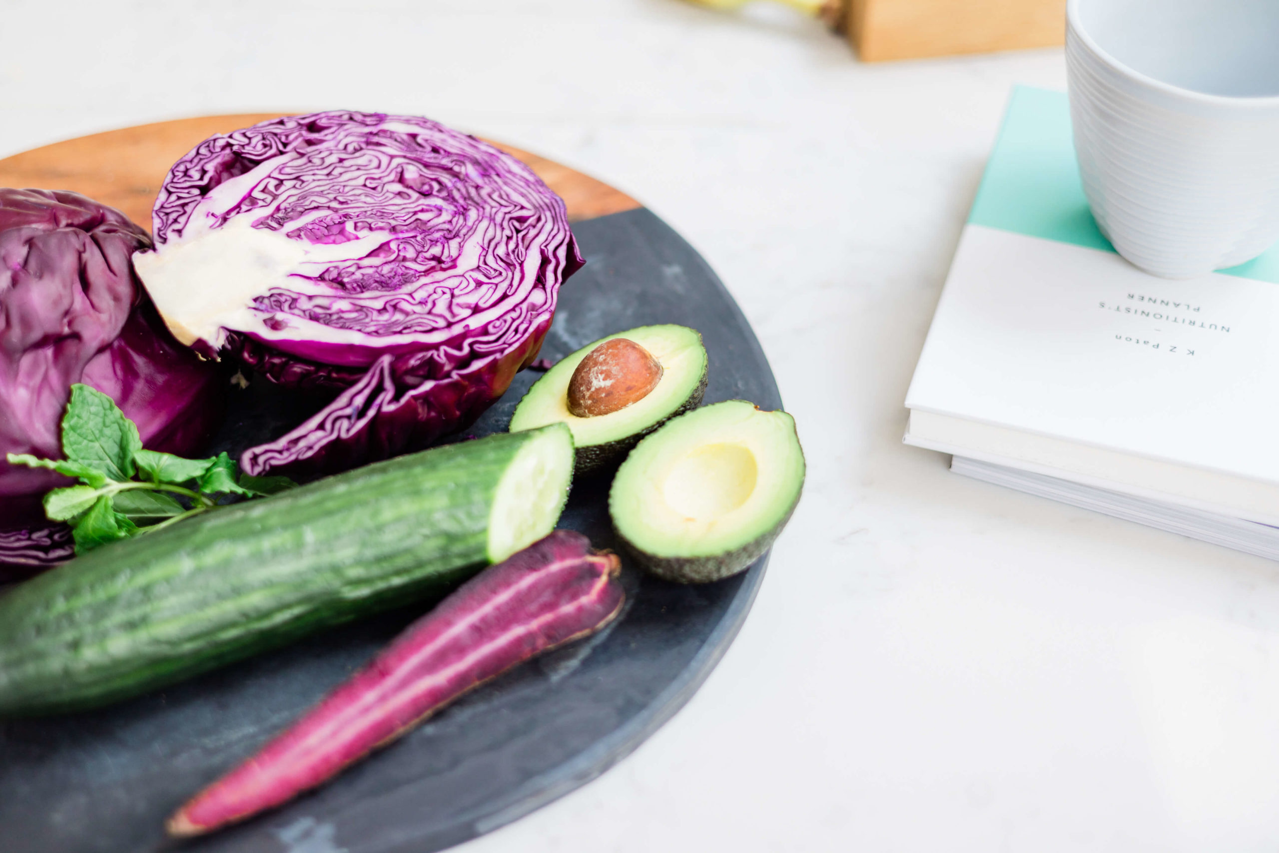 flat lay of vegetables and book on nutrition branding shoot by Chelmsford Kika Mitchell Photograpahy