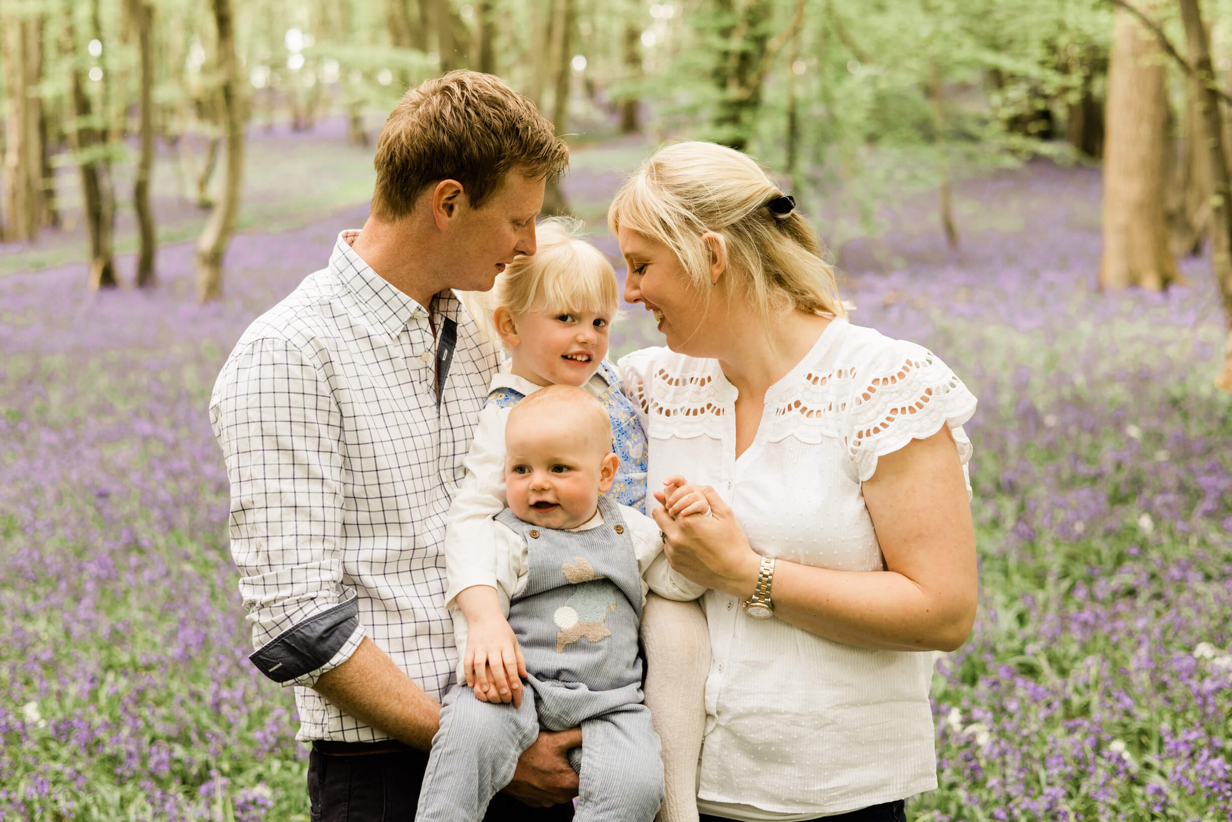 Happy family photography shoot in Essex. Relaxed, natural in the bluebell wood by Kika Mitchell Photography