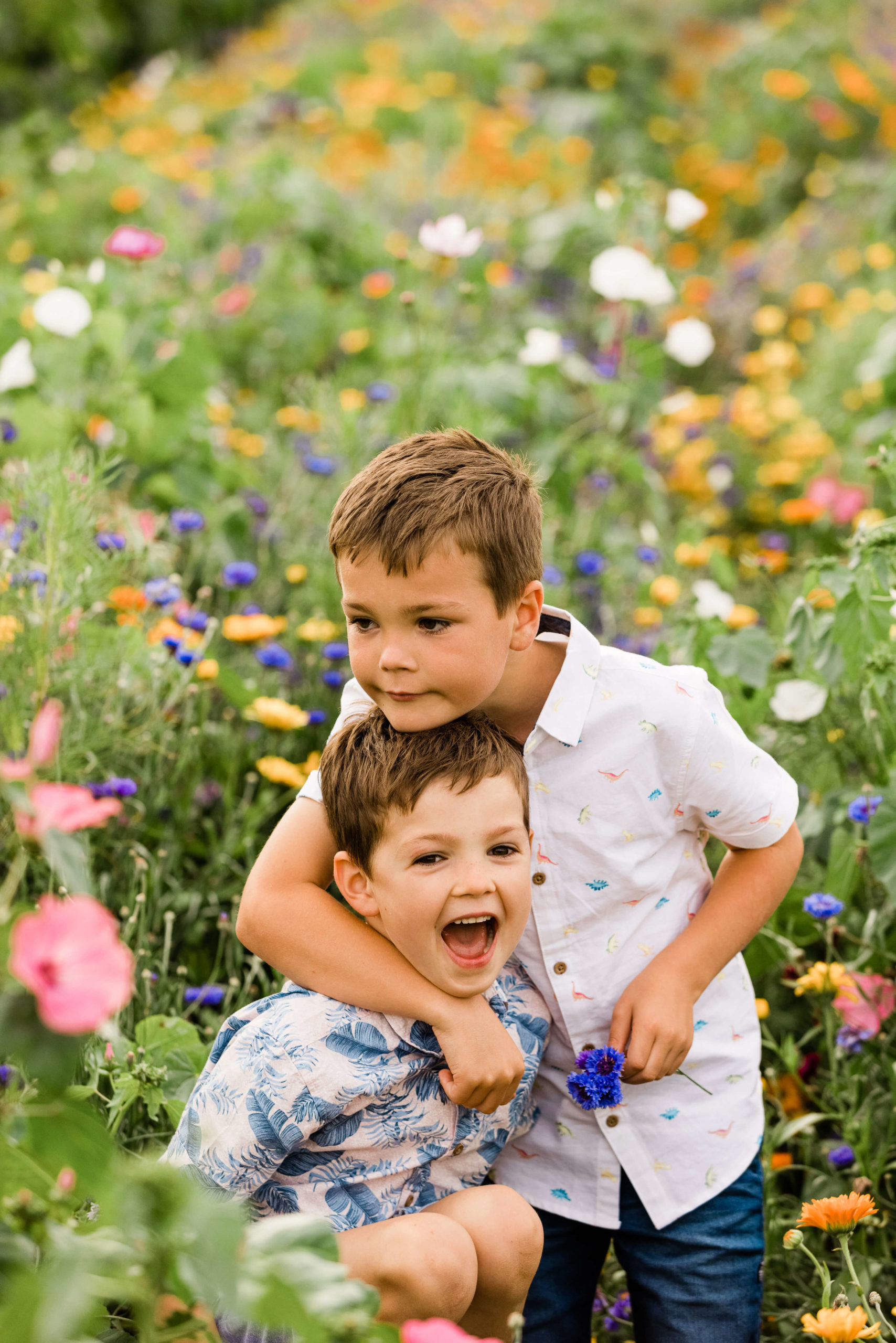 2 boys in wild flower meadow by Chelmsford photographer Kika Mitchell photography