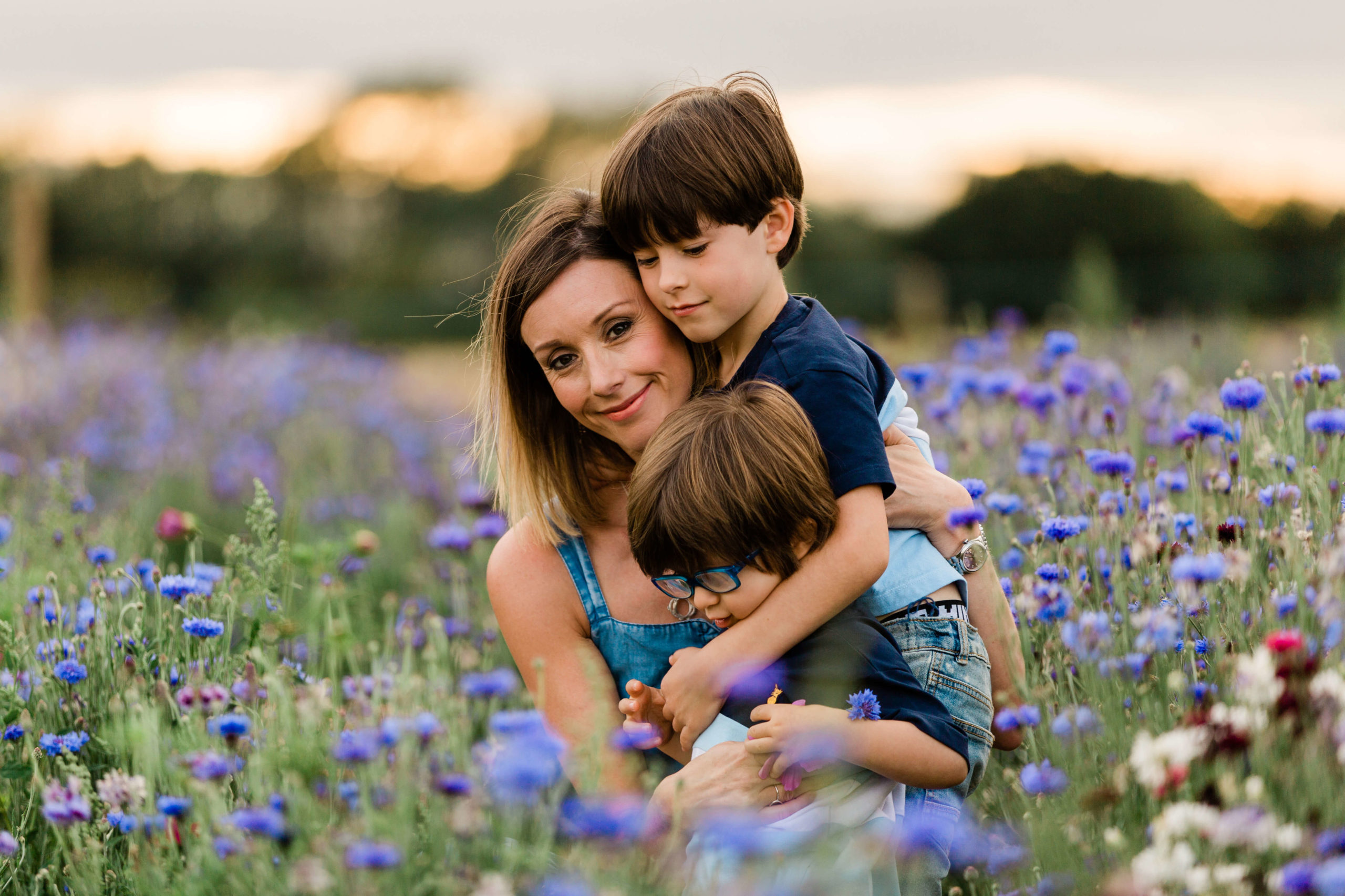 Mother and sons on wild flower meadow shoot at sunset by Chelmsford photographer Kika Mitchell