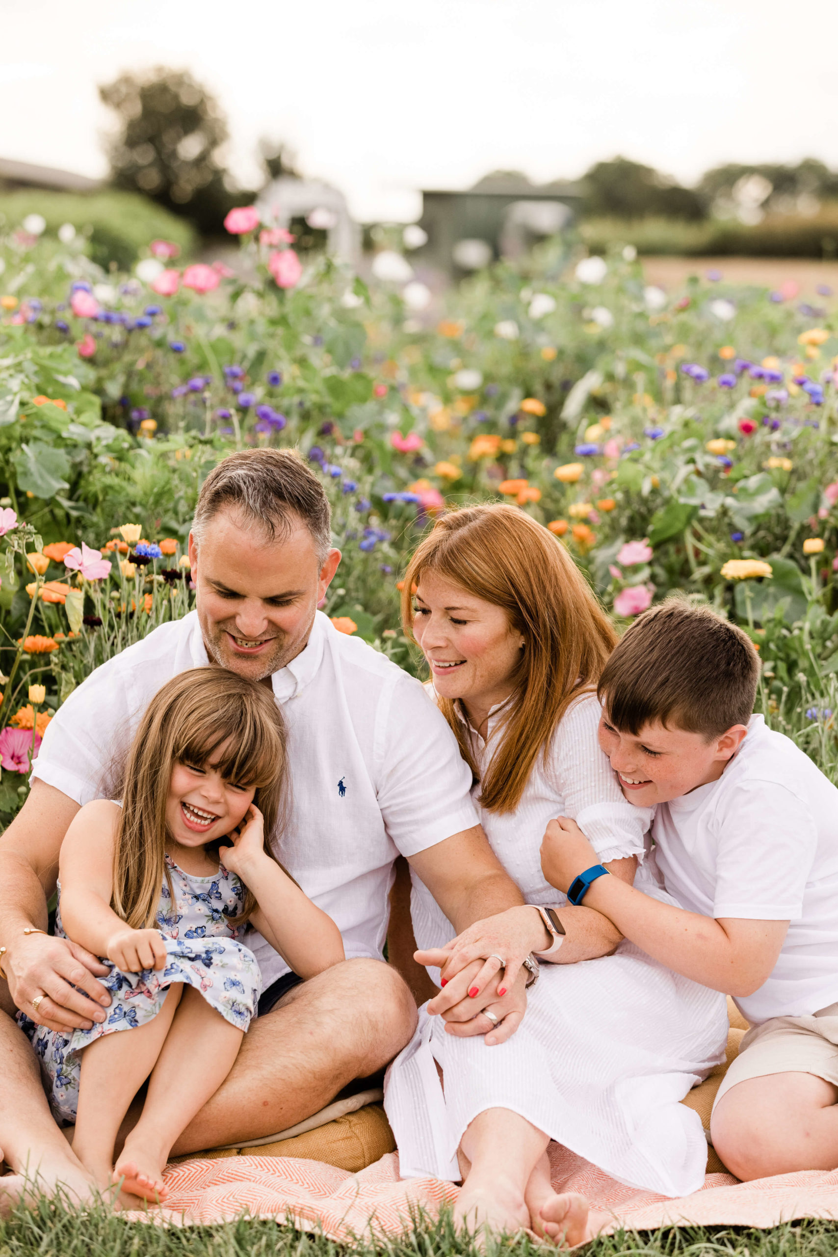 family of 4 among the wildflowers shoot by KIka Mitchell photography Chelmsford